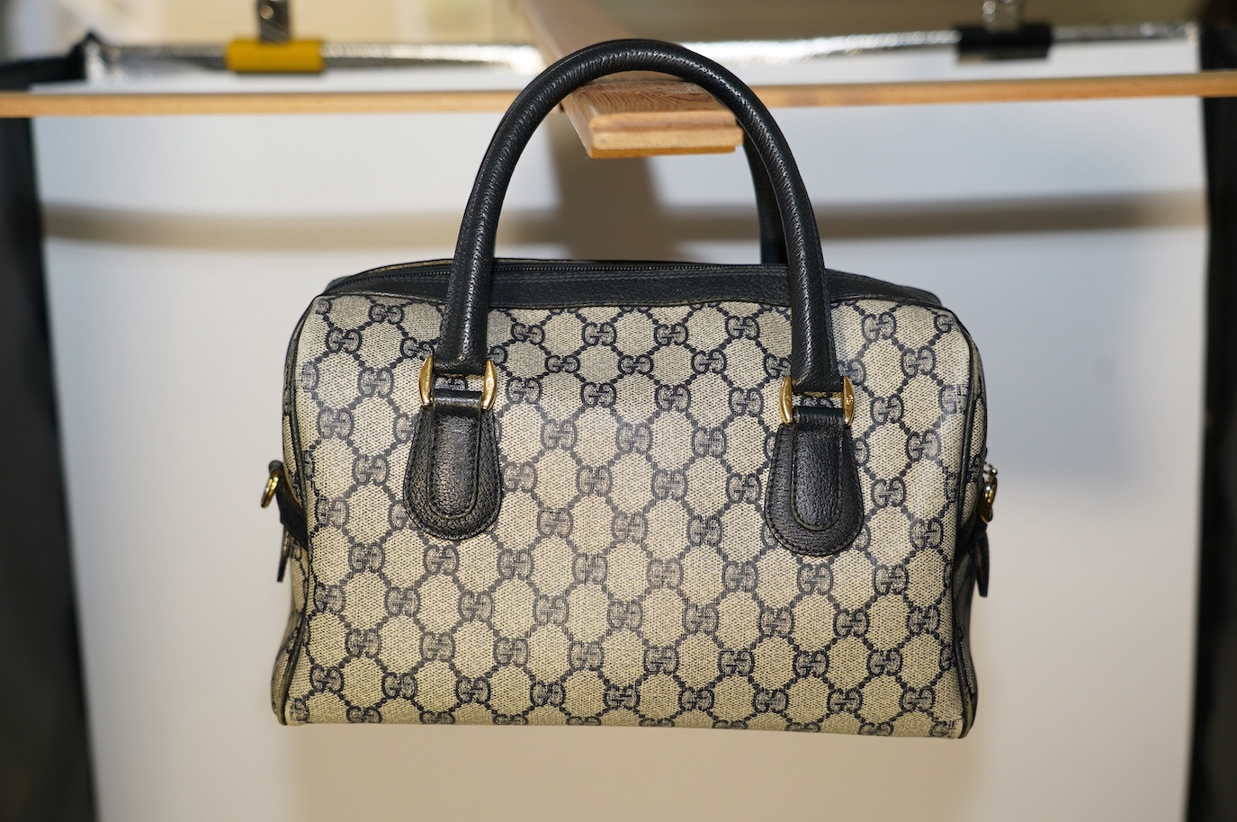 A Gucci monogram blue canvas handbag, wallet and purse